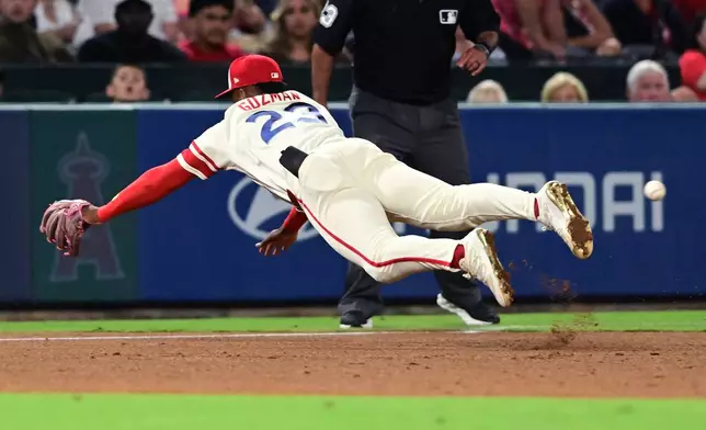 Los Angeles Angels Denzer Guzman dives but can't make the catch on a RBI double by Houston Astros Cam Smith during the sixth inning of a baseball game Wednesday, July 29, 2026, in Anaheim, Calif. (AP Photo/Wally Skalij)