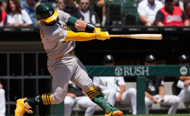 Athletics' Shea Langeliers hits a solo home run during the first inning of a baseball game against the Chicago White Sox in Chicago, Sunday, July 12, 2026. (AP Photo/Nam Y. Huh)
