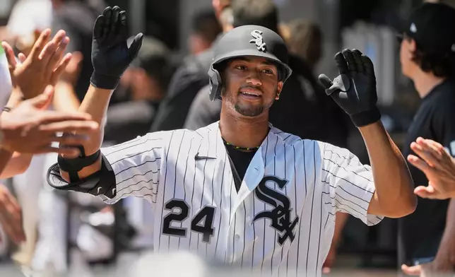 Chicago White Sox's Braden Montgomery celebrates with teammates after hitting a three-run home run during the first inning of a baseball game against the Athletics in Chicago, Sunday, July 12, 2026. (AP Photo/Nam Y. Huh)