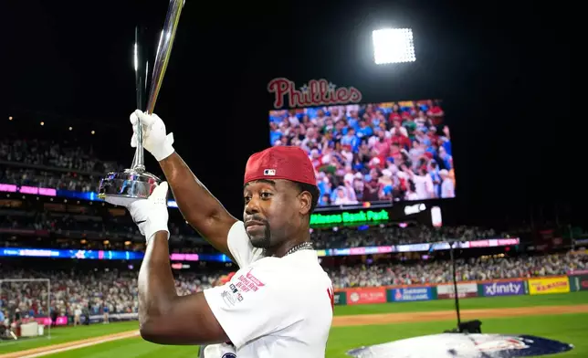 St. Louis Cardinals' Jordan Walker holds the trophy after he won the MLB baseball All-Star Home Run Derby, Monday, July 13, 2026, in Philadelphia. (AP Photo/Matt Slocum)