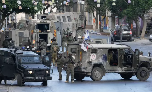 Israeli soldiers operate in the West Bank Palestinians city of Nablus, Sunday, July 26, 2026. (AP Photo/Majdi Mohammad)
