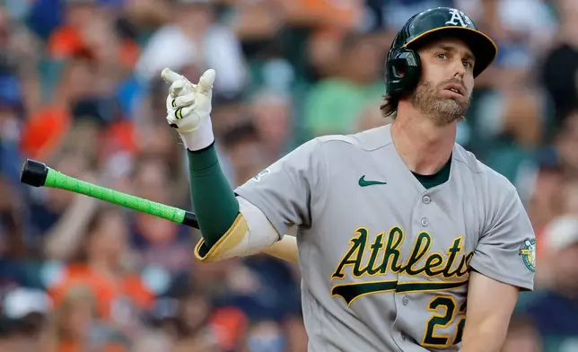 Athletics' Jeff McNeil tosses his bat after striking out against the Detroit Tigers during the fifth inning of a baseball game Wednesday, July 8, 2026, in Detroit. (AP Photo/Duane Burleson)