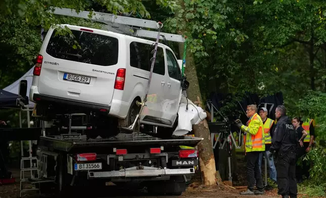 The vehicle used to ram into a crowd at the Pride March is removed in Berlin, Sunday, July 26, 2026. (AP Photo/Ebrahim Noroozi)