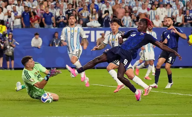 Cape Verde's Gilson Benchimol (9) takes a shot against Argentina goalkeeper Emiliano Martinez (23) during the World Cup round of 32 soccer match between Argentina and Cape Verde in Miami Gardens, Fla., Friday, July 3, 2026. (AP Photo/George Walker IV)