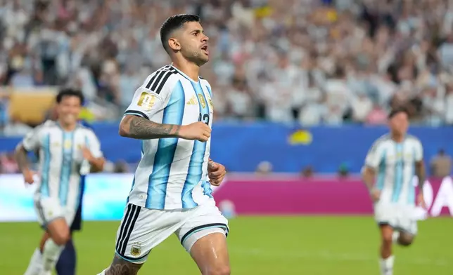 Argentina's Cristian Romero celebrates after Cape Verde's Diney Borges (3) scored an own goal during the World Cup round of 32 soccer match in Miami Gardens, Fla., Friday, July 3, 2026. (AP Photo/Rebecca Blackwell)