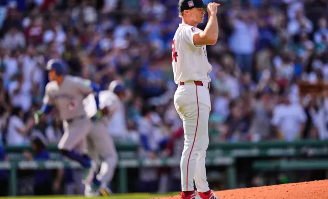 Boston Red Sox's Sonny Gray waits for Toronto Blue Jays' George Springer to round the bases on a three-run home run during the third inning of a baseball game, Saturday, July 25, 2026, in Boston. (AP Photo/Charles Krupa)