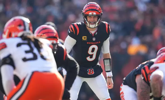 FILE - Cincinnati Bengals quarterback Joe Burrow (9) looks on during an NFL football game against the Cleveland Browns, Jan. 4, 2026, in Cincinnati. (AP Photo/Jeff Dean, File)