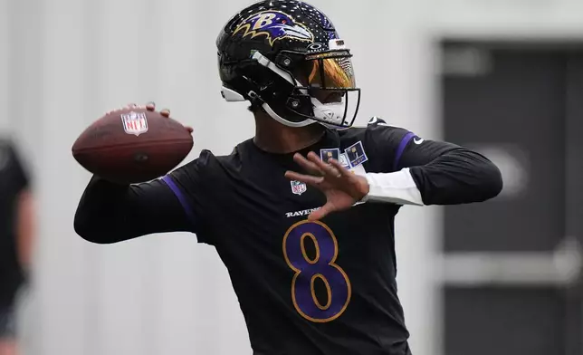 FILE - Baltimore Ravens quarterback Lamar Jackson (8) works out during the team's NFL football practice, May 27, 2026, at the Under Armour Performance Center in Owings Mills, Md. (AP Photo/Stephanie Scarbrough, File)