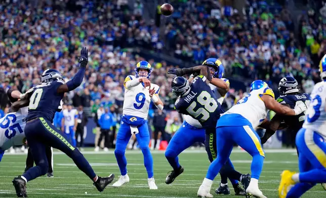 FILE - Los Angeles Rams quarterback Matthew Stafford (9) passes the ball during the NFC Championship NFL football game, Jan. 25, 2026, in Seattle. (AP Photo/Ben VanHouten, File)