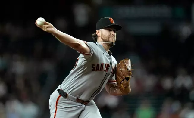 San Francisco Giants starting pitcher Landen Roupp throws against the Arizona Diamondbacks during the first inning of a baseball game, Tuesday, June 30, 2026, in Phoenix. (AP Photo/Ross D. Franklin)