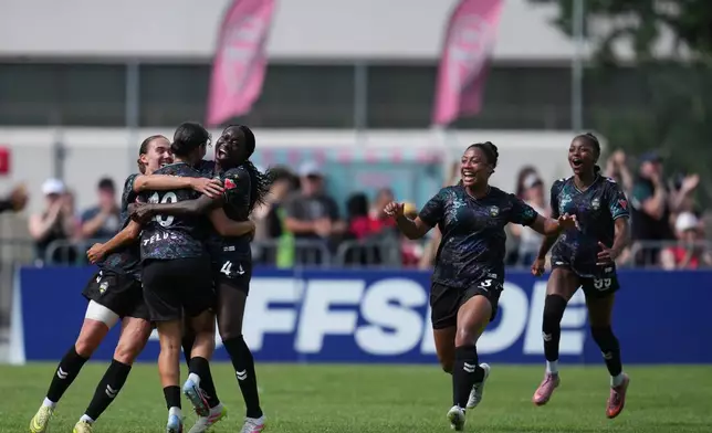 Vancouver Rise FC's Anais Oularbi, middle, left, celebrates with teammates after scoring a goal during a NSL match against Toronto AFC in Burnaby, British Columbia, Sunday, June 28, 2026. (AP Photo/Abbie Parr)