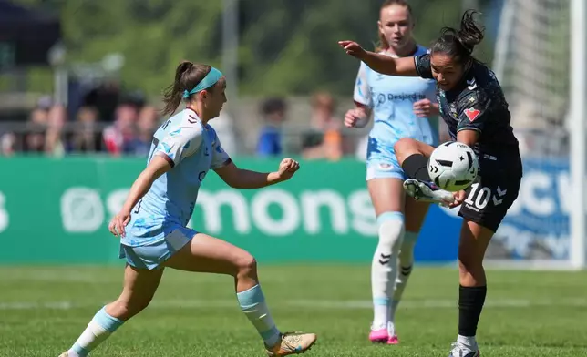 Vancouver Rise FC's Camila Reyes (10), right, controls the ball during a NSL match against Toronto AFC in Burnaby, British Columbia, Sunday, June 28, 2026. (AP Photo/Abbie Parr)