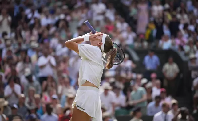 Karolina Muchova of the Czech Republic celebrates her victory against Coco Gauff of the United States in their semifinal women's singles match at the Wimbledon Tennis Championships in London, Thursday, July 9, 2026. (AP Photo/Kin Cheung)