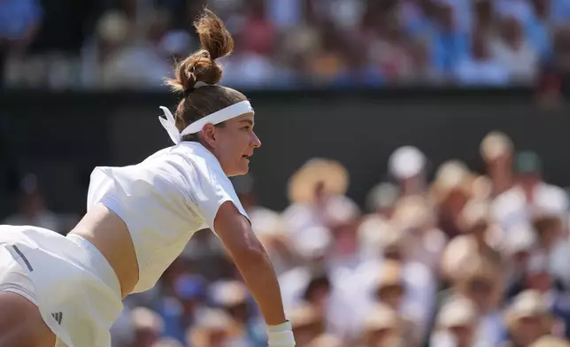 Karolina Muchova of the Czech Republic serves to Coco Gauff of the United States in their semifinal women's singles match at the Wimbledon Tennis Championships in London, Thursday, July 9, 2026. (AP Photo/Kin Cheung)