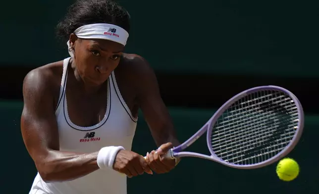 Coco Gauff of the United States returns the ball to Karolina Muchova of the Czech Republic in their semifinal women's singles match at the Wimbledon Tennis Championships in London, Thursday, July 9, 2026. (AP Photo/Kirsty Wigglesworth)