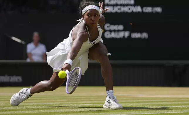 Coco Gauff of the United States returns the ball to Karolina Muchova of the Czech Republic in their semifinal women's singles match at the Wimbledon Tennis Championships in London, Thursday, July 9, 2026. (AP Photo/Kin Cheung)