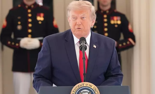 President Donald Trump speaks on West Executive Drive at the White House during a showcase for the upcoming Freedom 250 Grand Prix auto race, Monday, July 13, 2026, in Washington. (AP Photo/Alex Brandon)