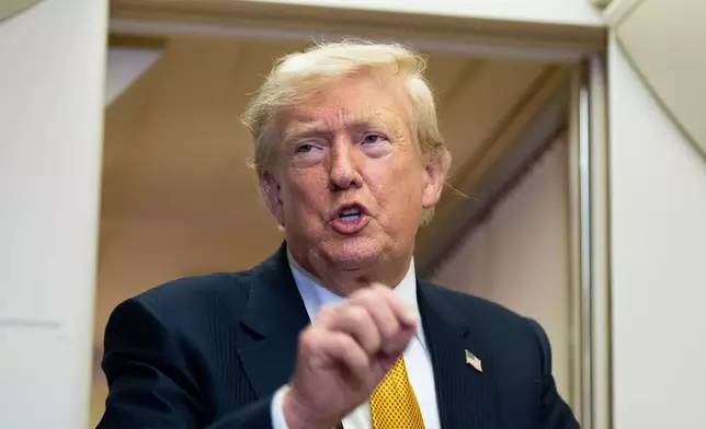 President Donald Trump speaks with reporters in flight on Air Force One after landing at U.S. Air Force Base at RAF Mildenhall, in Suffolk, Eastern England, Wednesday, July 8, 2026. (AP Photo/Alex Brandon)