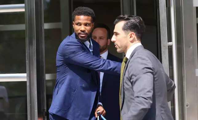 Former NBA player Malik Beasley, center, exits Brooklyn federal court, Wednesday, July 1, 2026, in New York. (AP Photo/Heather Khalifa) CORRECTION: name of the photographer corrected to Heather Khalifa instead of Yuki Iwamura