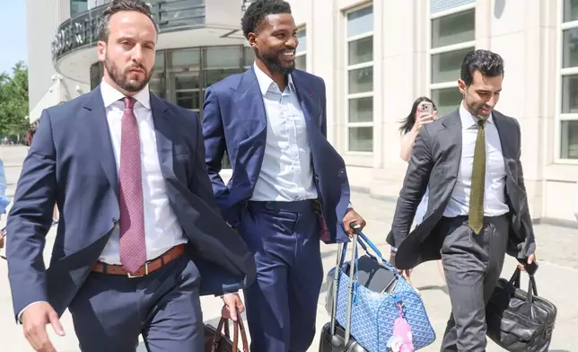 Former NBA player Malik Beasley, center, exits Brooklyn federal court, Wednesday, July 1, 2026, in New York. (AP Photo/Heather Khalifa) CORRECTION: name of the photographer corrected to Heather Khalifa instead of Yuki Iwamura