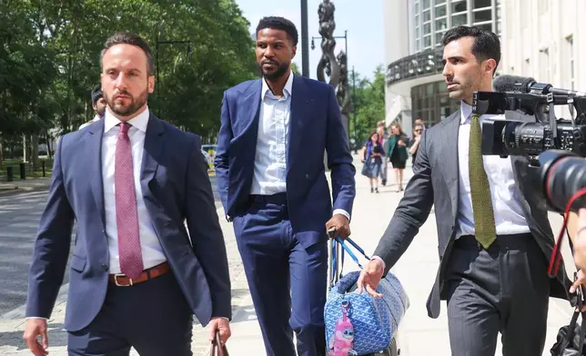 Former NBA player Malik Beasley, center, exits Brooklyn federal court, Wednesday, July 1, 2026, in New York. (AP Photo/Heather Khalifa) CORRECTION: name of the photographer corrected to Heather Khalifa instead of Yuki Iwamura