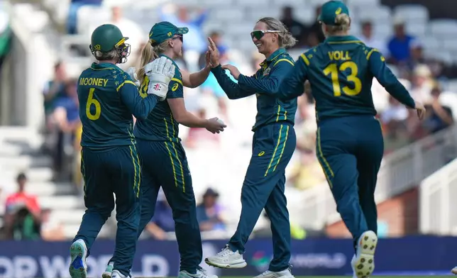 Australia's Ashleigh Gardner, second from right, celebrates with teammates the wicket of West Indies' Stafanie Taylor during the Women's T20 Cricket World Cup semifinal between Australia and West Indies in London, Tuesday, June 30, 2026. (AP Photo/Alastair Grant)