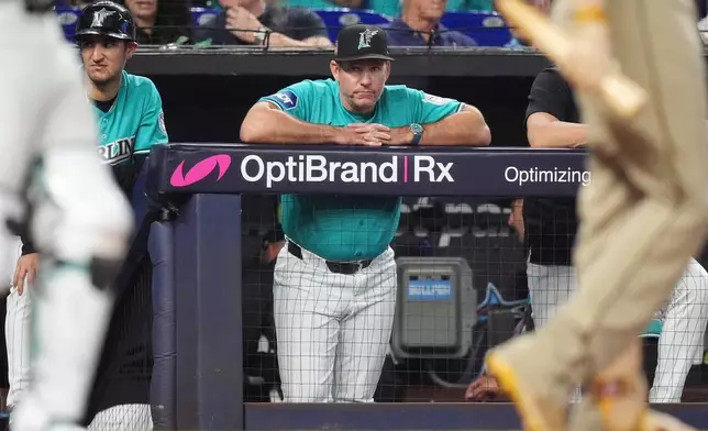 Miami Marlins manager Clayton McCullough watches play during the eigth inning of a baseball game against the San Diego Padres, Sunday, July 26, 2026, in Miami. (AP Photo/Rebecca Blackwell)