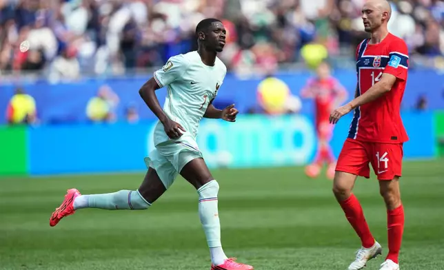 France's Ousmane Dembele celebrates after scoring his side's second goal during the World Cup Group I soccer match between Norway and France in Foxborough, Mass., near Boston, Friday, June 26, 2026. (AP Photo/Martin Meissner)