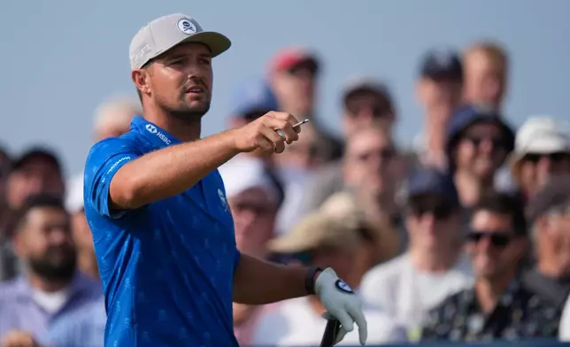 Bryson DeChambeau of the United States looks down the 9th fairway from the tee as he prepares to play during the second day of the British Open Golf championships at Royal Birkdale golf club, in Southport, England, Friday, July 17, 2026. (AP Photo/David Goldman)