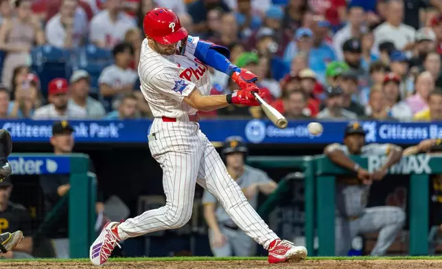 Philadelphia Phillies' Trea Turner hits an RBI double in the seventh inning of a baseball game against the Pittsburgh Pirates, Tuesday, June 30, 2026, in Philadelphia. (AP Photo/Laurence Kesterson)