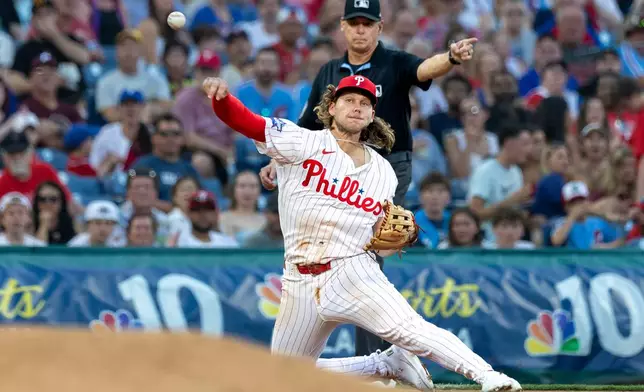 Philadelphia Phillies third baseman Alec Bohm throws to first for the out on Pittsburgh Pirates' Konnor Griffin during the fifth inning of a baseball game, Tuesday, June 30, 2026, in Philadelphia. (AP Photo/Laurence Kesterson)
