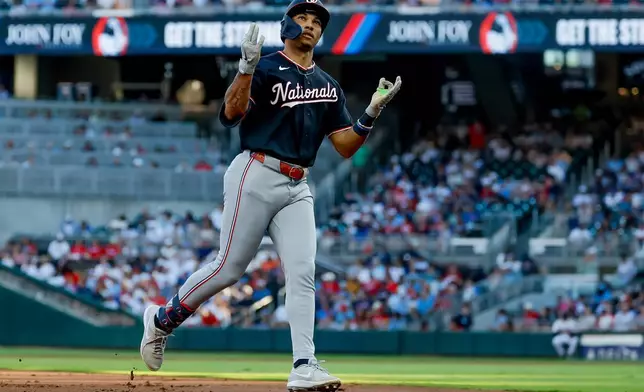 Washington Nationals' Daylen Lile reacts while rounding the bases after hitting a solo home run against the Atlanta Braves during the second inning of a baseball game, Thursday, July 30, 2026, in Atlanta. (AP Photo/Erik S. Lesser)