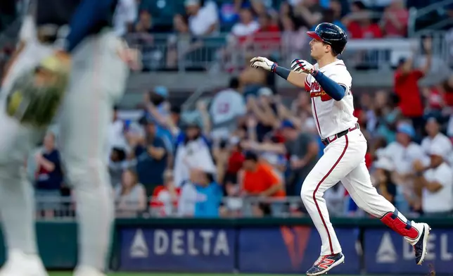 Atlanta Braves' Mike Yastrzemski reacts while rounding the bases after hitting a two-run home run against the Washington Nationals during the fifth inning of a baseball game, Thursday, July 30, 2026, in Atlanta. (AP Photo/Erik S. Lesser)