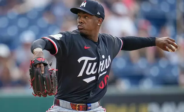 Minnesota Twins' Kendry Rojas pitches in the first inning of a baseball game against the Cleveland Guardians in Cleveland, Tuesday, July 21, 2026. (AP Photo/Sue Ogrocki)