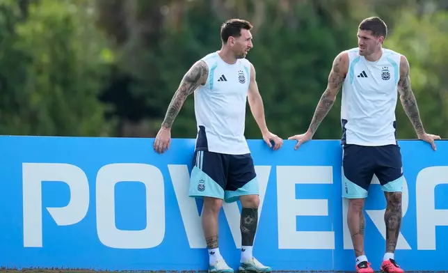 Argentina's Lionel Messi, left, talks with Rodrigo De Paul during a training session on the eve of the team's World Cup round of 32 soccer match against Cape Verde, in Fort Lauderdale, Fla., Thursday, July 2, 2026. (AP Photo/Rebecca Blackwell)