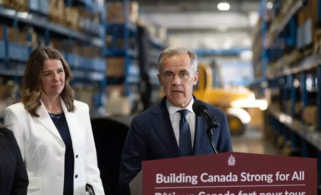 Canada's Prime Minister Mark Carney and Alberta Premier Danielle Smith announce a proposed pipeline from Alberta to the B.C. coast in Calgary, Thursday, July 02, 2026. (Todd Korol/The Canadian Press via AP)