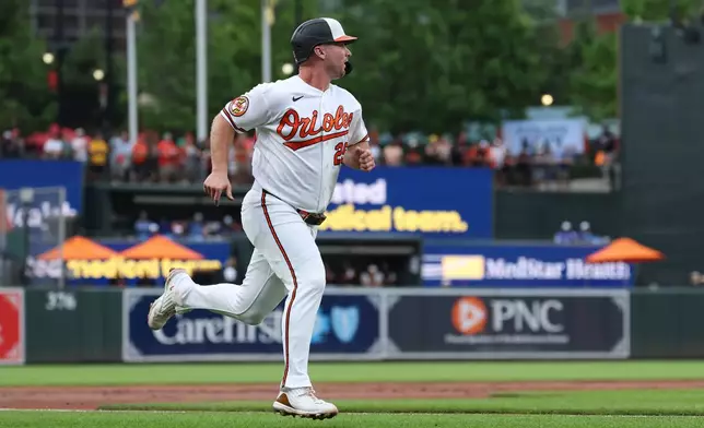 Baltimore Orioles' Pete Alonso runs to score on a single hit by Samuel Basallo off Kansas City Royals pitcher Noah Cameron during the second inning of a baseball game, Saturday, July 11, 2026, in Baltimore. (AP Photo/Terrance Williams)