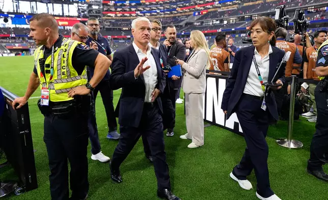France head coach Didier Deschamps leaves the pitch at the end of the World Cup semifinal soccer match between France and Spain in Arlington, Texas, near Dallas, Tuesday, July 14, 2026. (AP Photo/Ashley Landis)