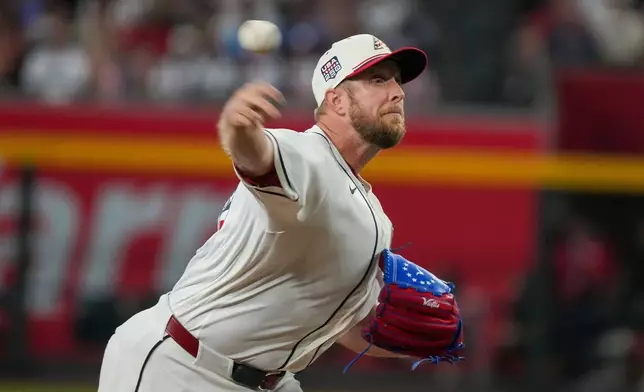 Arizona Diamondbacks pitcher Merrill Kelly works against the Milwaukee Brewers during the first inning of an baseball game Saturday, July 4, 2026, in Phoenix. (AP Photo/Darryl Webb)