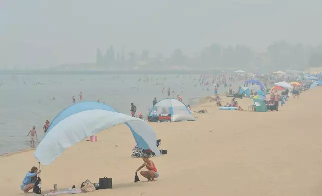 Hazy skies from Canadian wildfires cover Silver Beach and Lake Michigan, Thursday, July 16, 2026, in St. Joseph, Mich. (Don Campbell/The Herald-Palladium via AP)