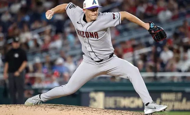 Arizona Diamondbacks pitcher Paul Sewald throws during the ninth inning of a baseball game against the Washington Nationals, Friday, July 24, 2026, in Washington. (AP Photo/Daniel Kucin Jr.)