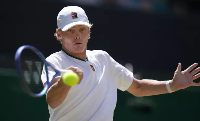 Cruz Hewitt of Australia returns the ball to Jordan Lee of the United States in the boy's singles final at the Wimbledon Tennis Championships in London, Sunday, July 12, 2026. (AP Photo/Brian Inganga) CORRECTION: Corrects date to July 12.