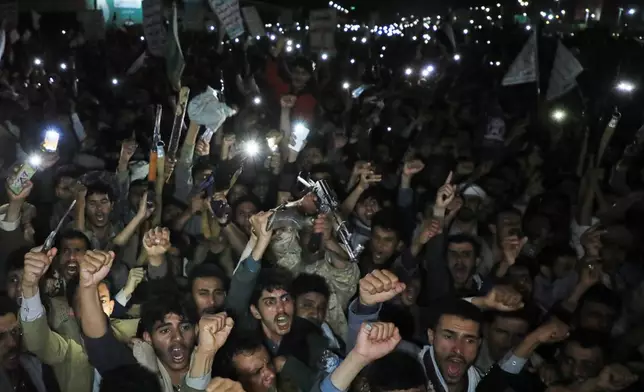 Houthi supporters shout slogans as they demonstrate against airstrikes on Sanaa International Airport in Sanaa, Yemen, Monday, July 13, 2026. (AP Photo/Osamah Abdulrahman)