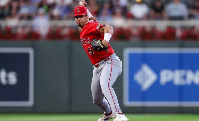 Los Angeles Angels third baseman Vaughn Grissom throws to first base to get out Minnesota Twins' Kody Clemens during the sixth inning of a baseball game, Friday, July 10, 2026, in Minneapolis. (AP Photo/Matt Krohn)