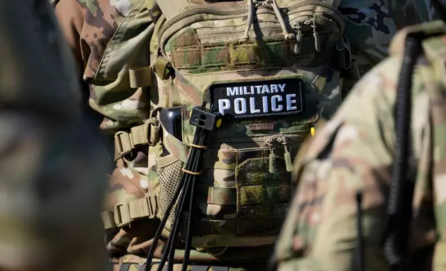 FILE - Members from the National Guard working as part of the Memphis Safe Task Force conduct a community safety patrol at Tom Lee Park, Oct. 12, 2025, in Memphis, Tenn. (AP Photo/George Walker IV, File)