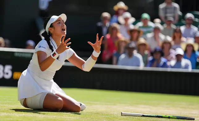 Alexandra Eala of the Philippines reacts afgter falling over during the women's singles fourth round match against Jasmine Paolini of Italy at the Wimbledon Tennis Championships in London, Monday, July 6, 2026.(AP Photo/Kirsty Wigglesworth)