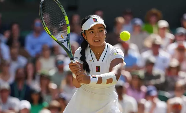 Alexandra Eala of the Philippines plays a return during the women's singles fourth round match against Jasmine Paolini of Italy at the Wimbledon Tennis Championships in London, Monday, July 6, 2026.(AP Photo/Kirsty Wigglesworth)