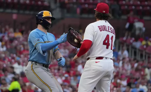 Milwaukee Brewers' Garrett Mitchell is tagged out by St. Louis Cardinals first baseman Alec Burleson during the fourth inning of a baseball game Thursday, July 9, 2026, in St. Louis. (AP Photo/Jeff Roberson)
