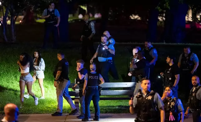 Chicago police officers attempt to disperse hundreds of young people near the Griffin Museum of Science and Industry in the Hyde Park neighborhood, Monday, May 25, 2026. (Tyler Pasciak LaRiviere/Chicago Sun-Times via AP, File)