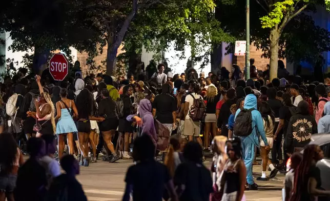 Hundreds of young people gather near the Griffin Museum of Science and Industry in the Hyde Park neighborhood as Chicago police officers attempt to disperse them, Monday, May 25, 2026. (Tyler Pasciak LaRiviere/Chicago Sun-Times via AP, File)